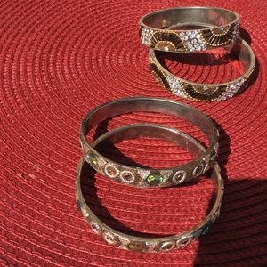 Two sets of 2 goldstone bangle bracelets.